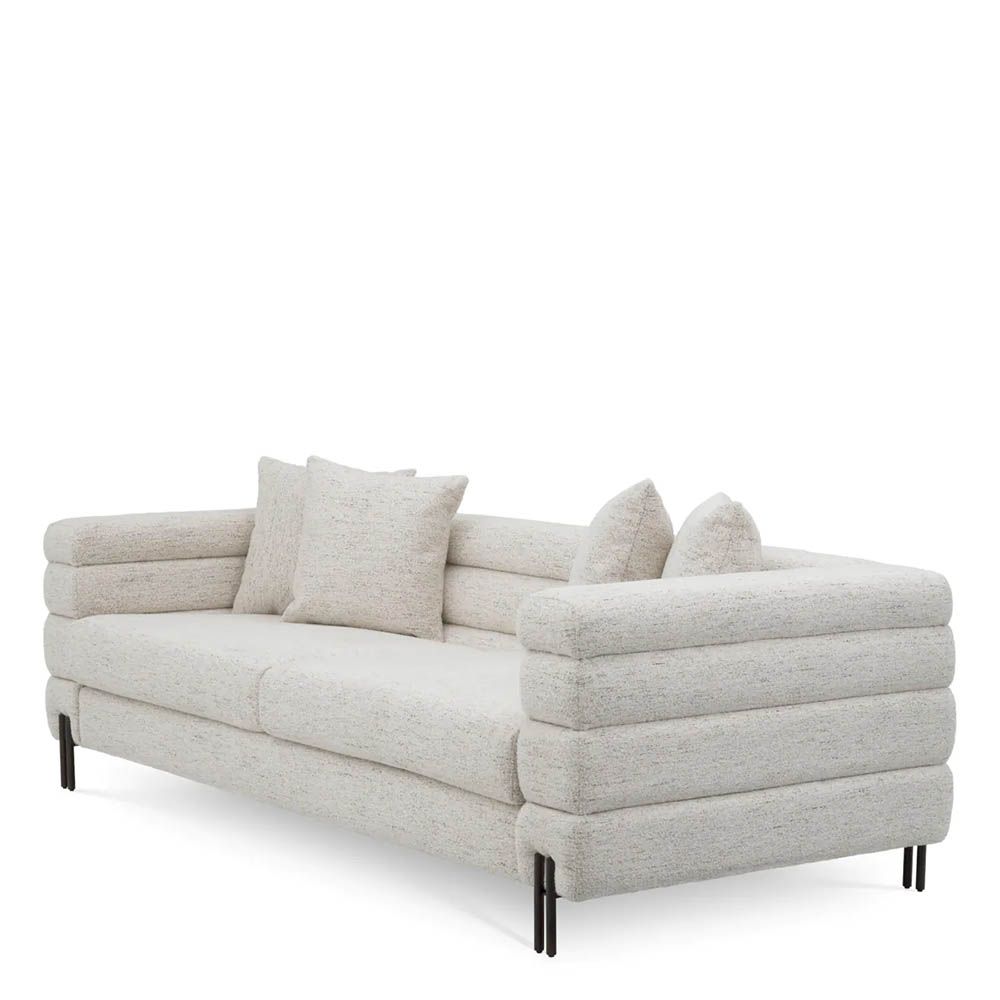 Off-white upholstered sofa with horizontal fluting