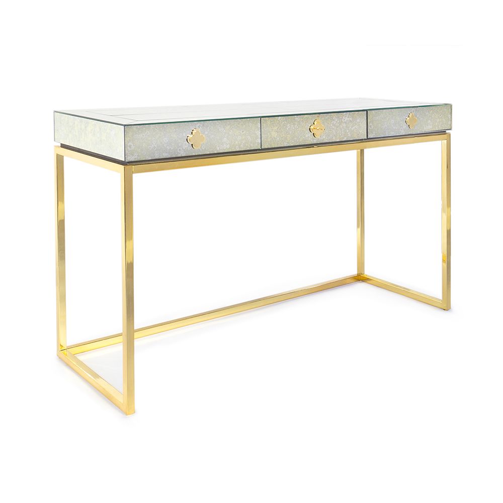 A glamorous, modern desk with a antiqued mirror table top and a polished brass base