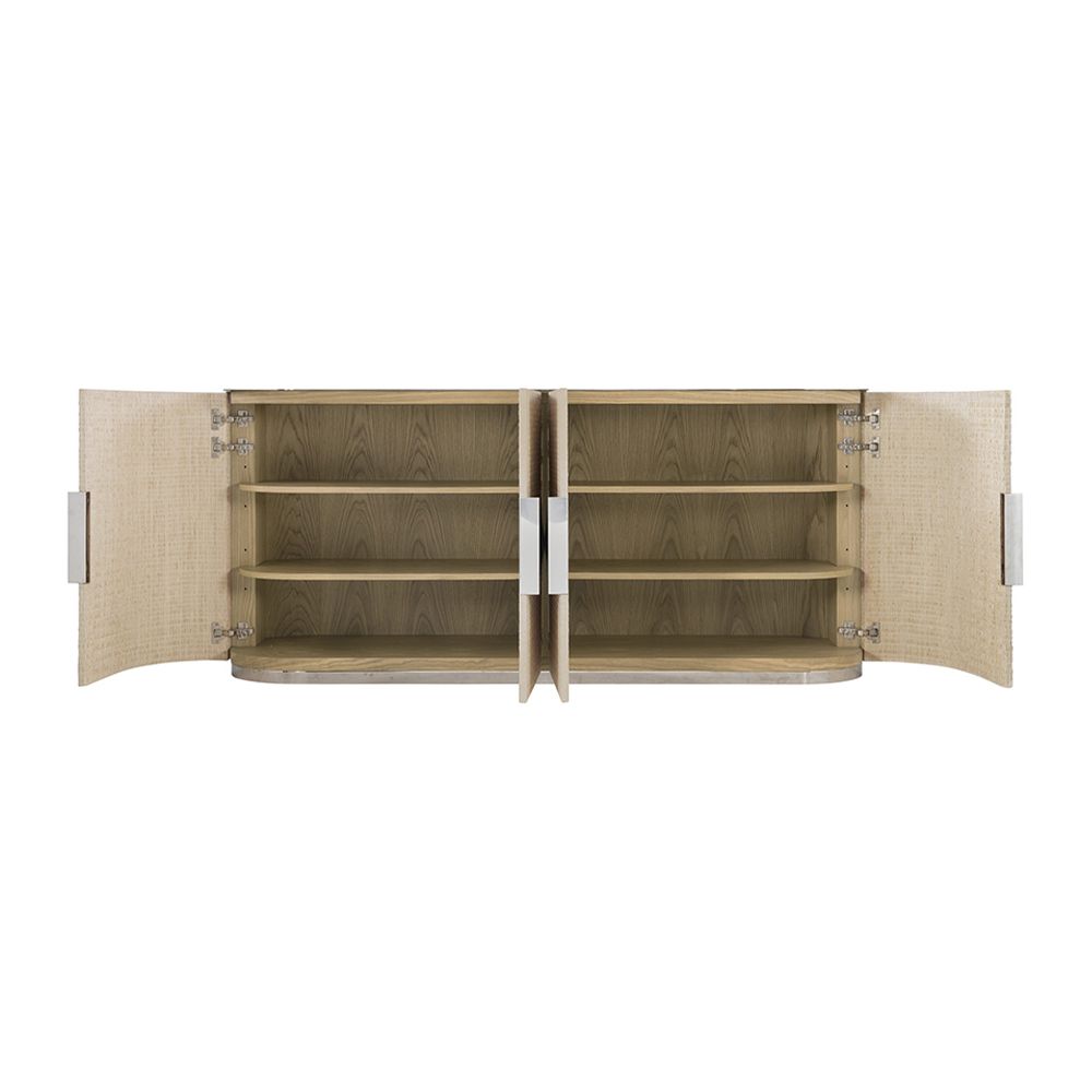 A stunning bleached raffia sideboard with four doors, interior shelving, a white oak veneer interior, polished stainless steel top and plinth base