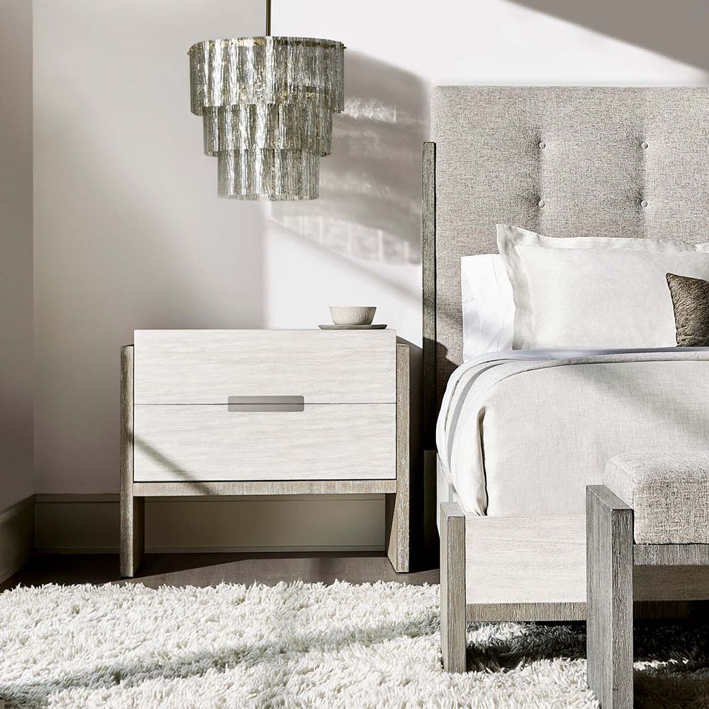 A beautiful bedside table by Bernhardt featuring a gorgeous two tone finish, two soft closing doors and a dual USB charger