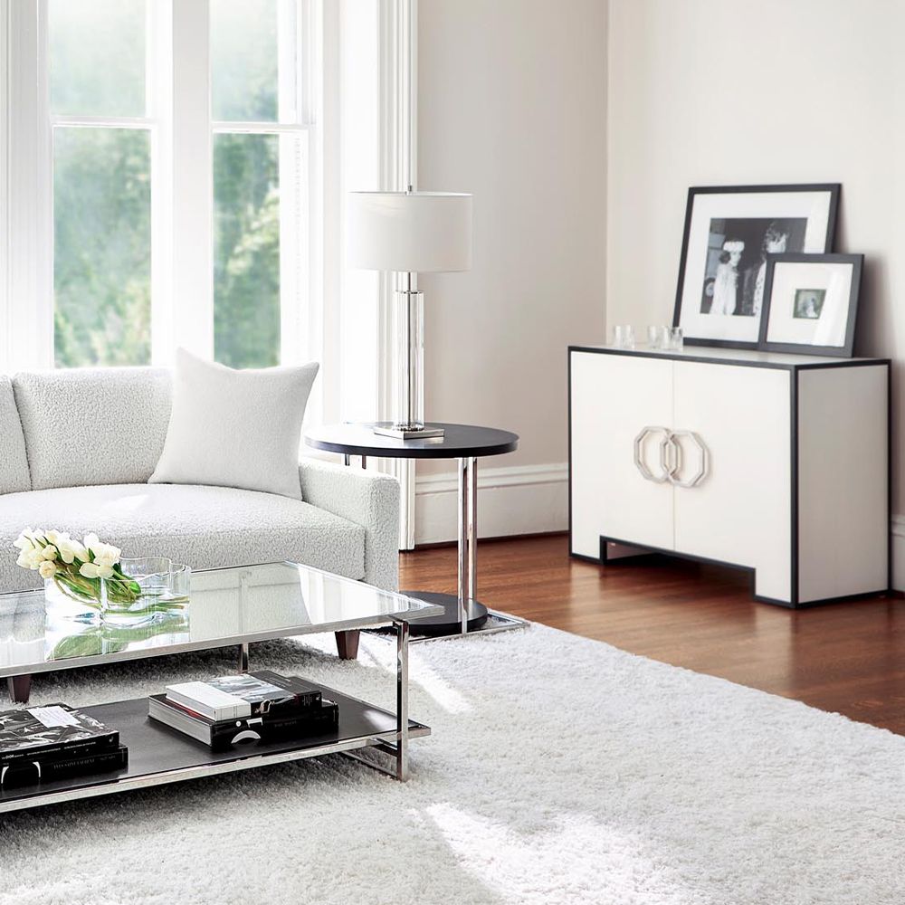 A sophisticated and spacious cabinet from Bernhardt with a two-tone finish, soft closing doors and adjustable shelves