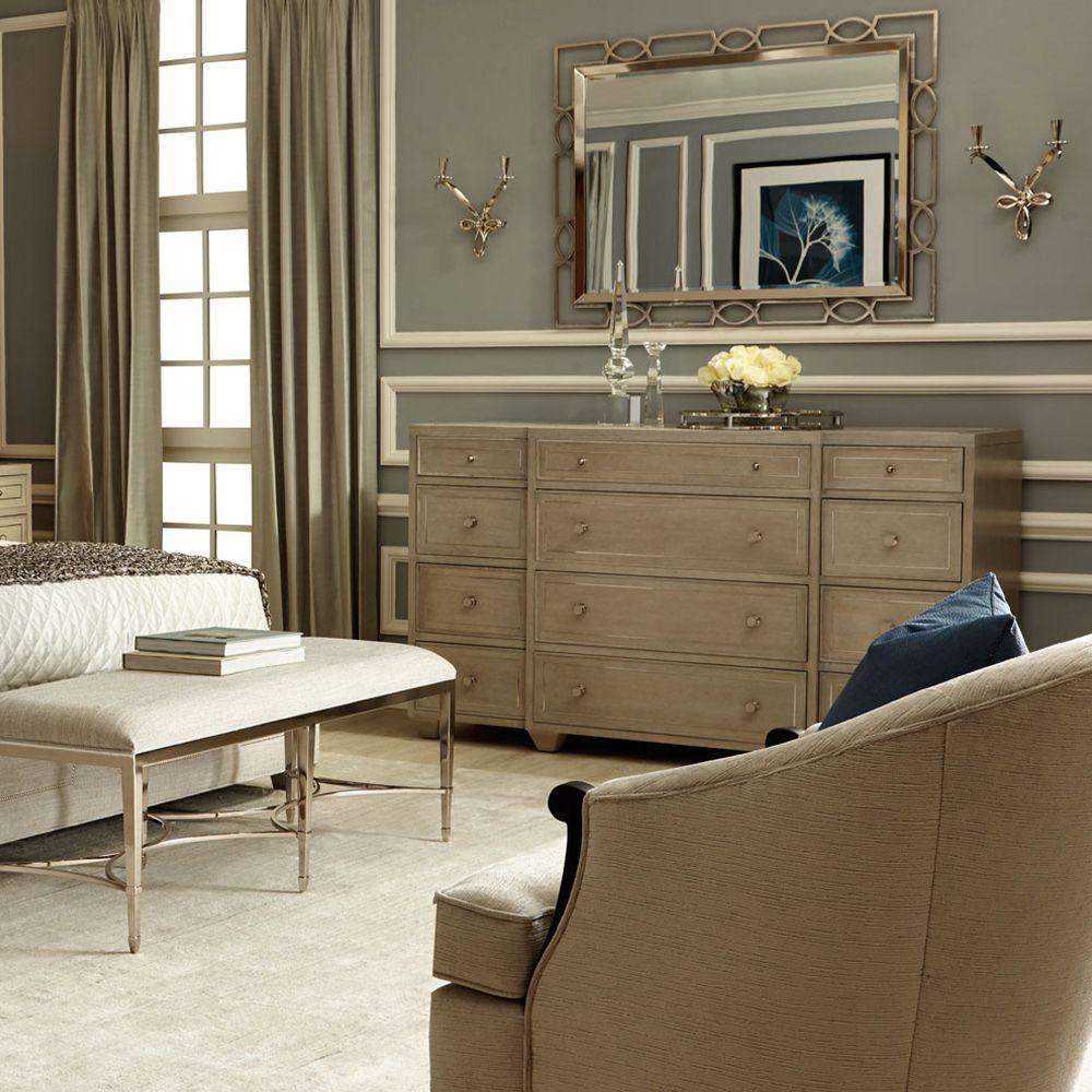 A gorgeous dresser from Bernhardt with an ash veneer finish, stainless steel metal inlay and twelve drawers