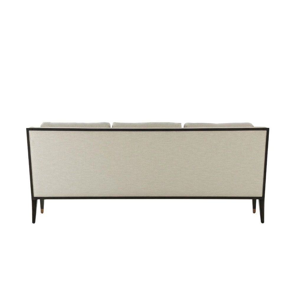 Sleek and sumptuous three seter sofa with dark outline