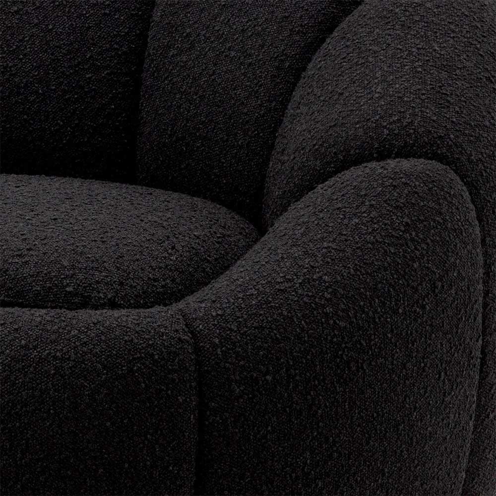 elegant black boucle upholstered swivel chair with brass base 