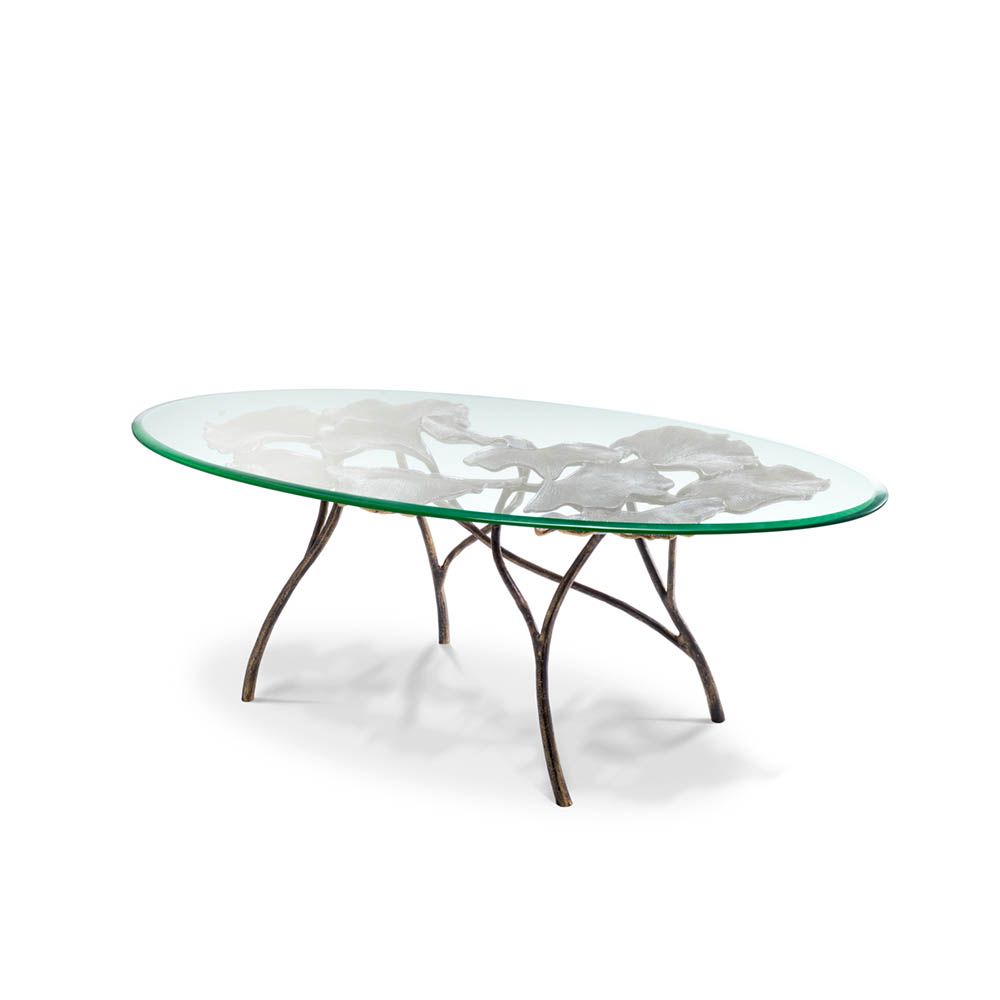Opulent coffee table with leaf design brass base and round glass top