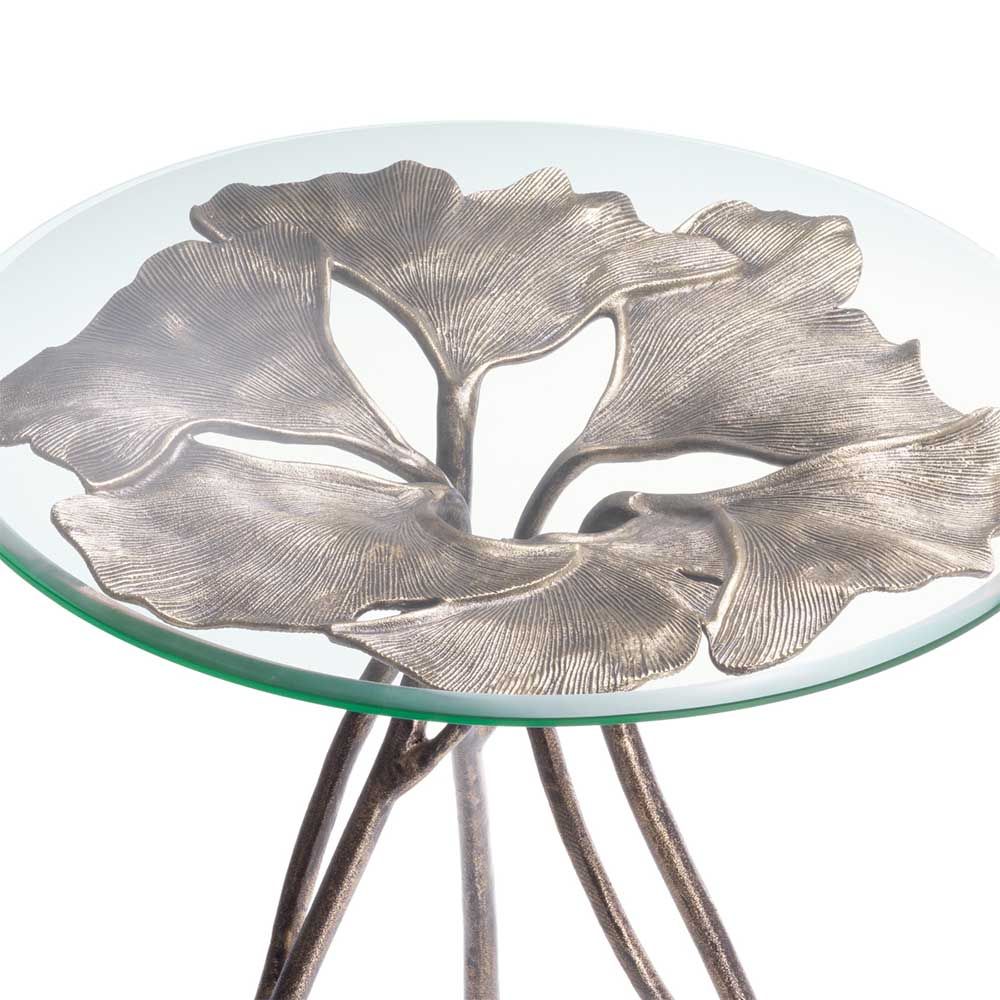 glass top side table with leaf silhouette