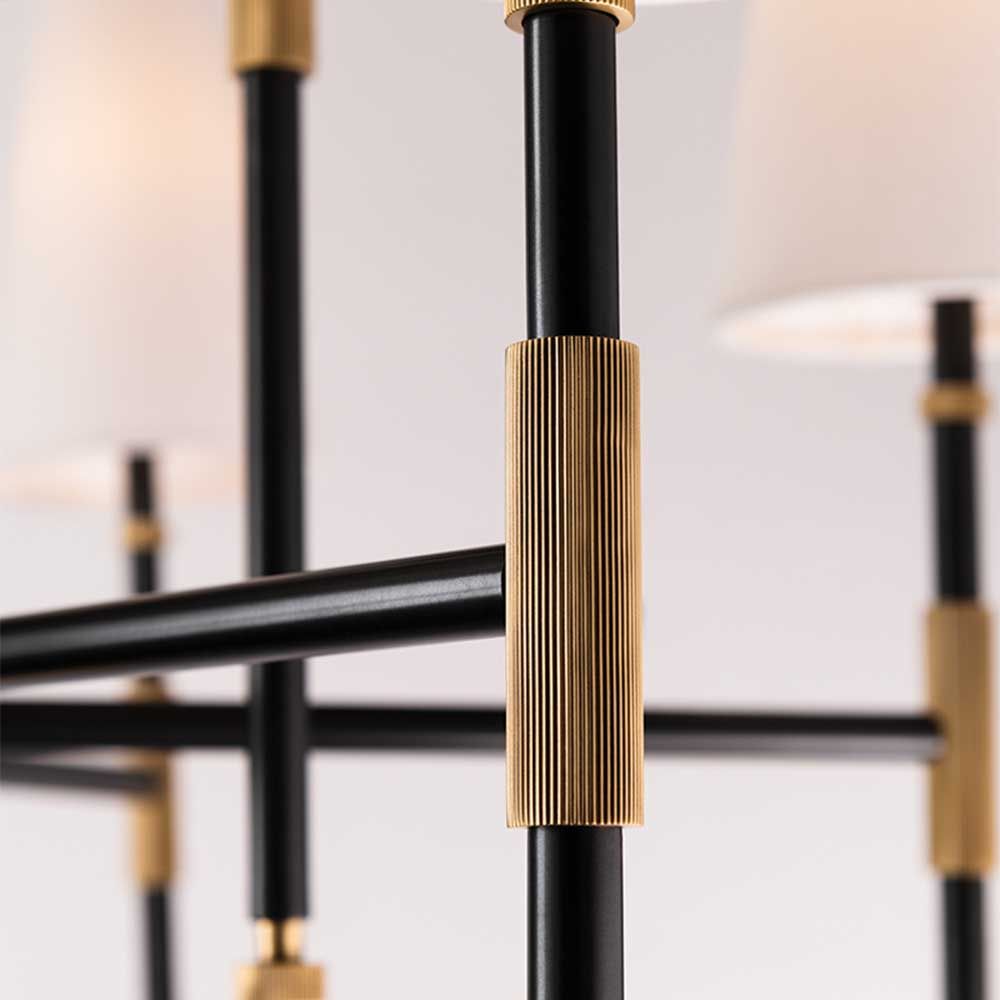 Glamorous six-light chandelier with brass accents and conical shades