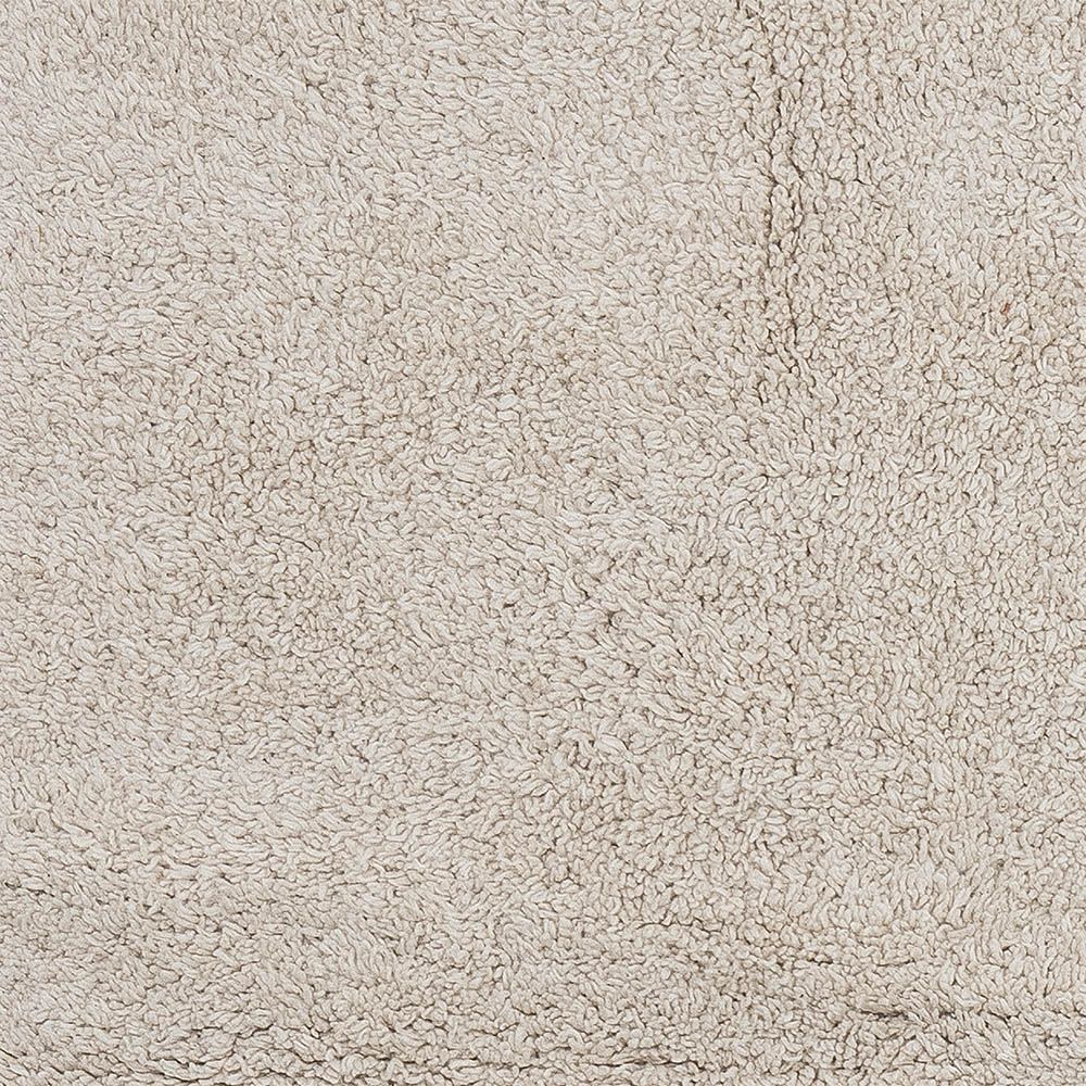 Natural wool rug with fringe detail