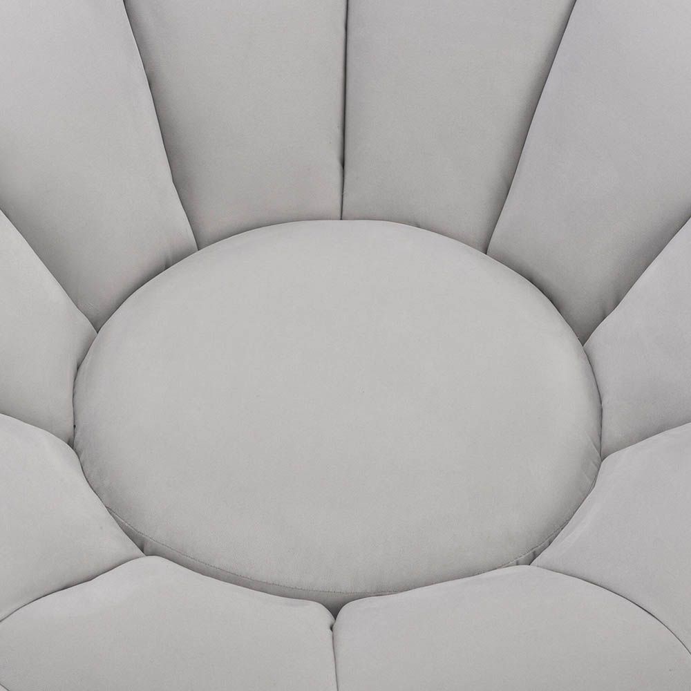 Statement grey velvet swivel chair with enveloping shell-shaped backrest 