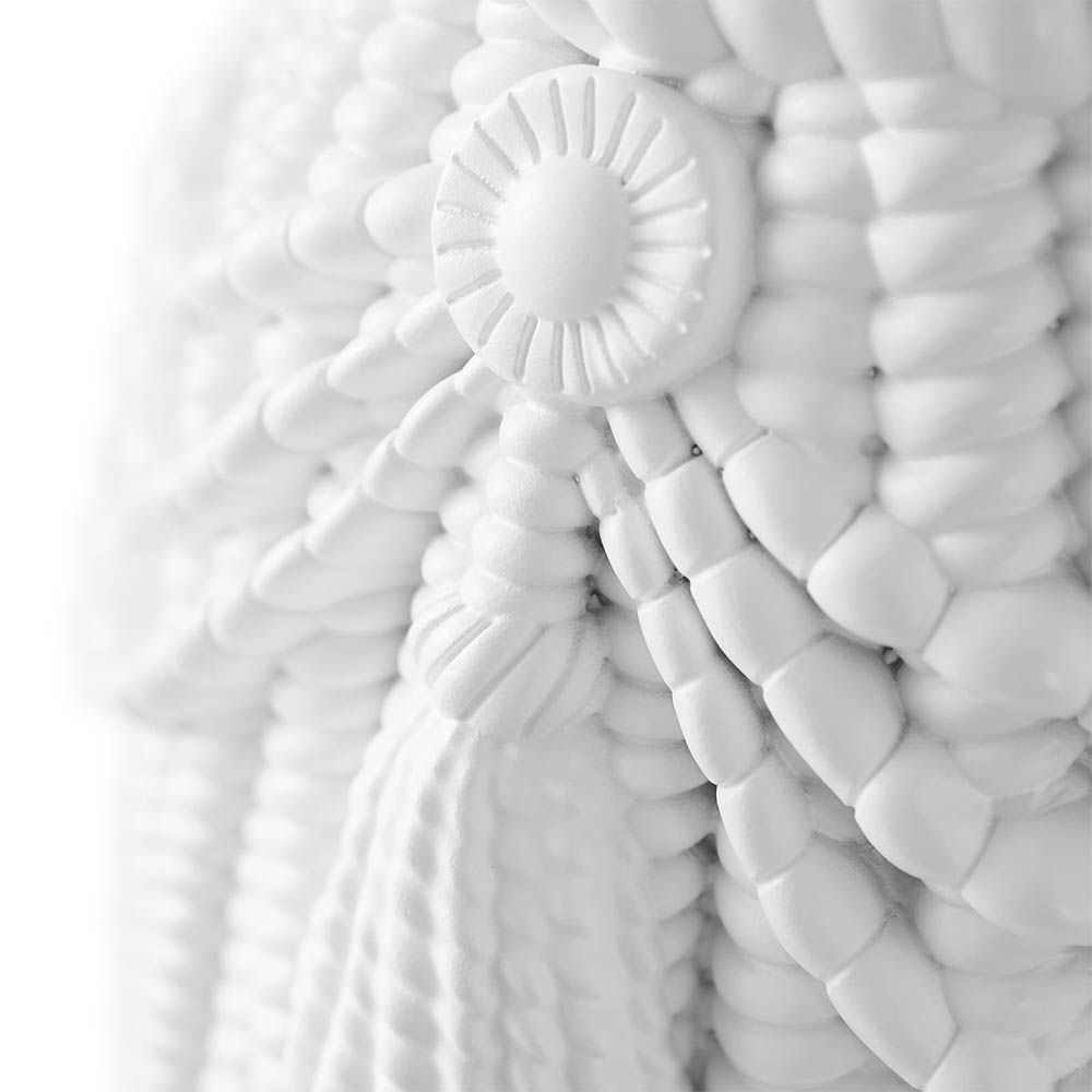 Giant Tassel Stool with ornately sculpted tassels in a polished white acrylic