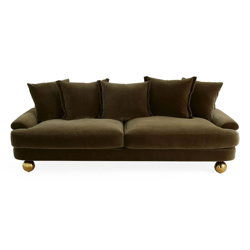 Olive green sofa with oversized brass orb feet