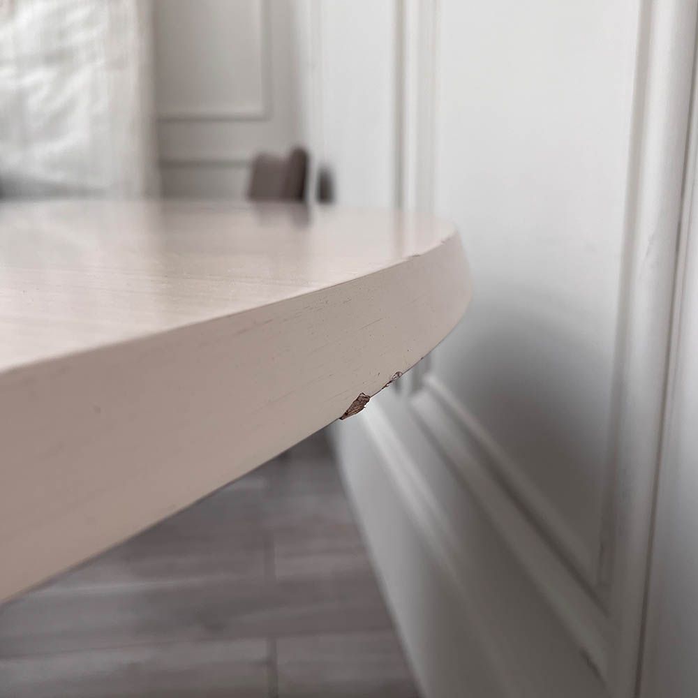 Round and decorative dining table with sculptural base