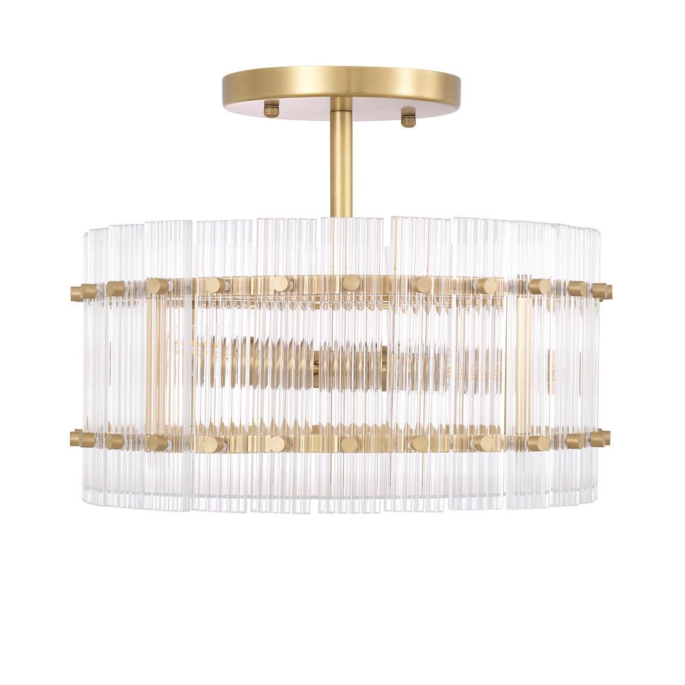 glamorous ceiling lamp in antique brass and encircled by ribbed clear glass