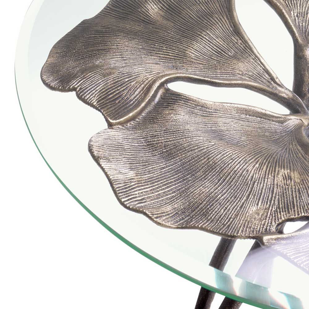 glass top side table with leaf silhouette