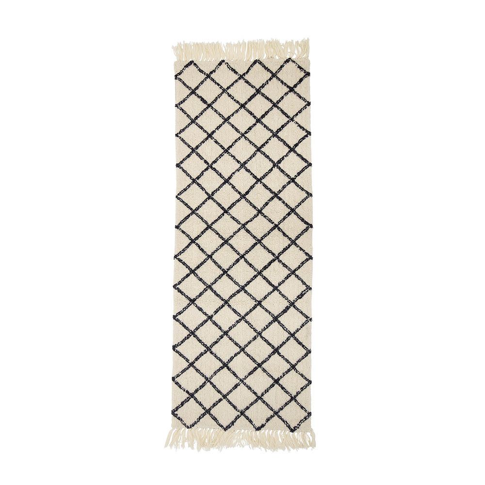 Sumptuous black and cream rug with fringe detail