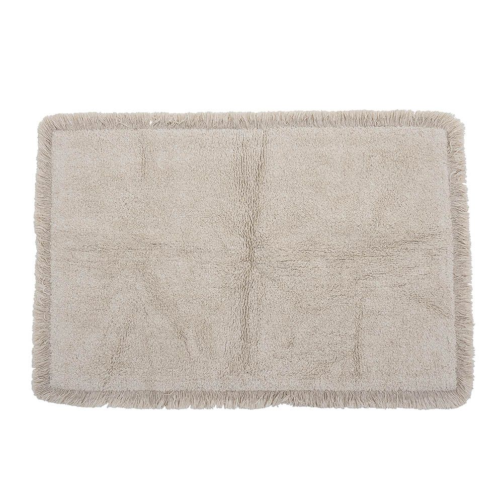 Natural wool rug with fringe detail