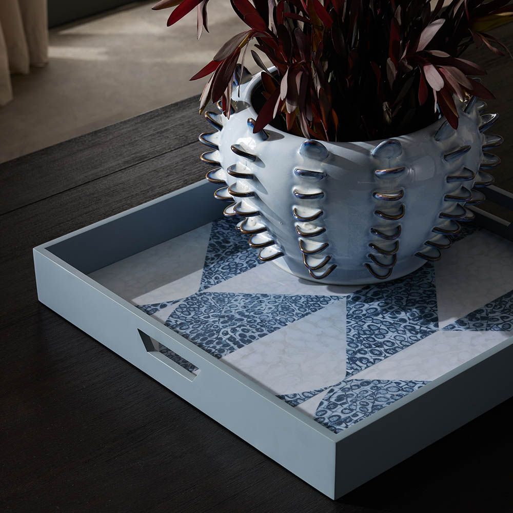 blue tray with patterned base and inset handles