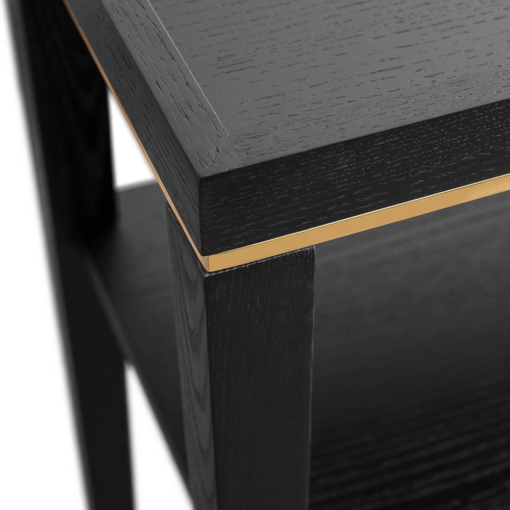 Console table with solid wood legs and finished in a brushed brass 