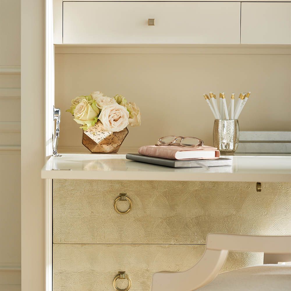 Elegant bureau with drop down desk and ivory/gold drawers for storage