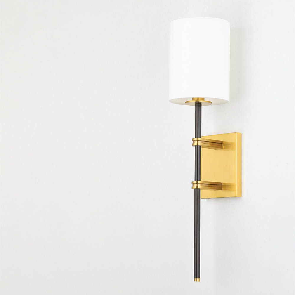 Modern wall sconce with brass fixture for added glamour