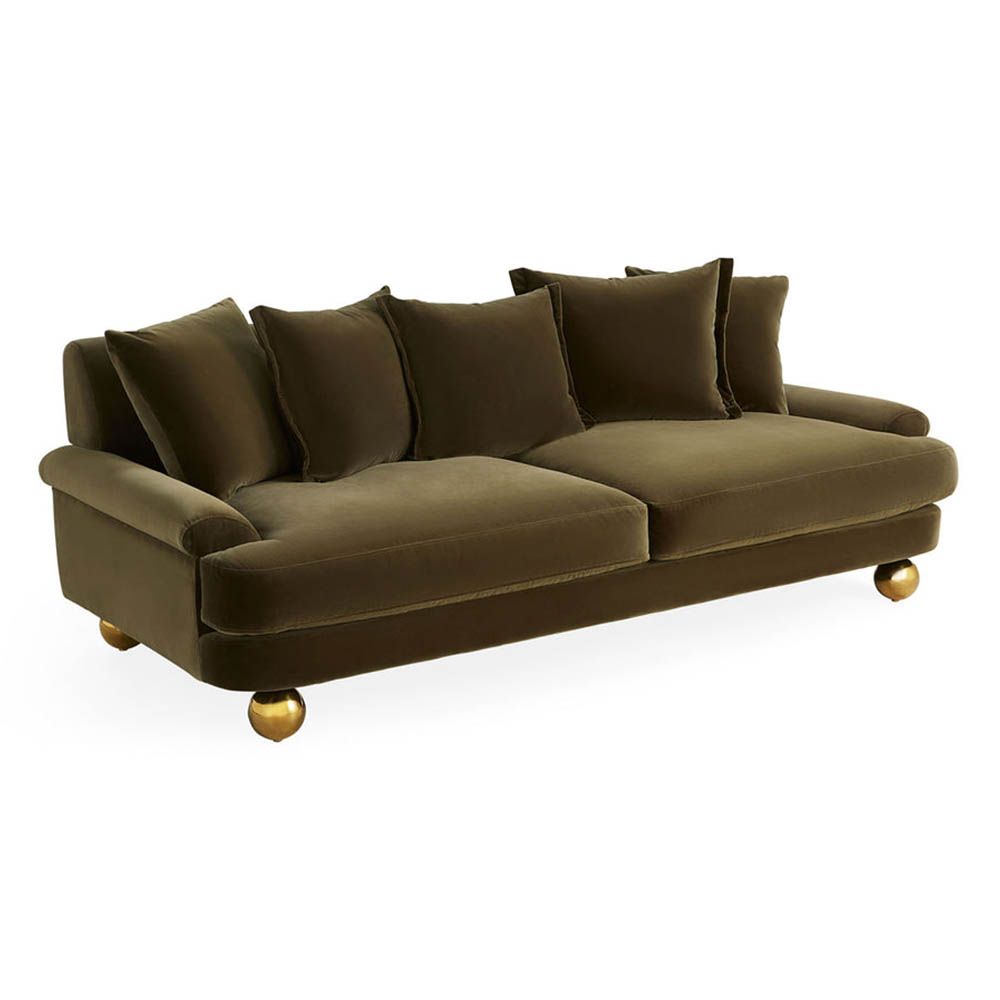 Olive green sofa with oversized brass orb feet