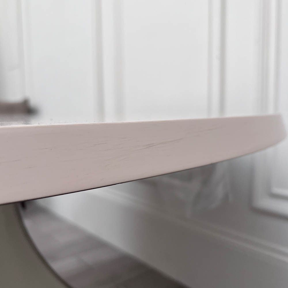 Round and decorative dining table with sculptural base