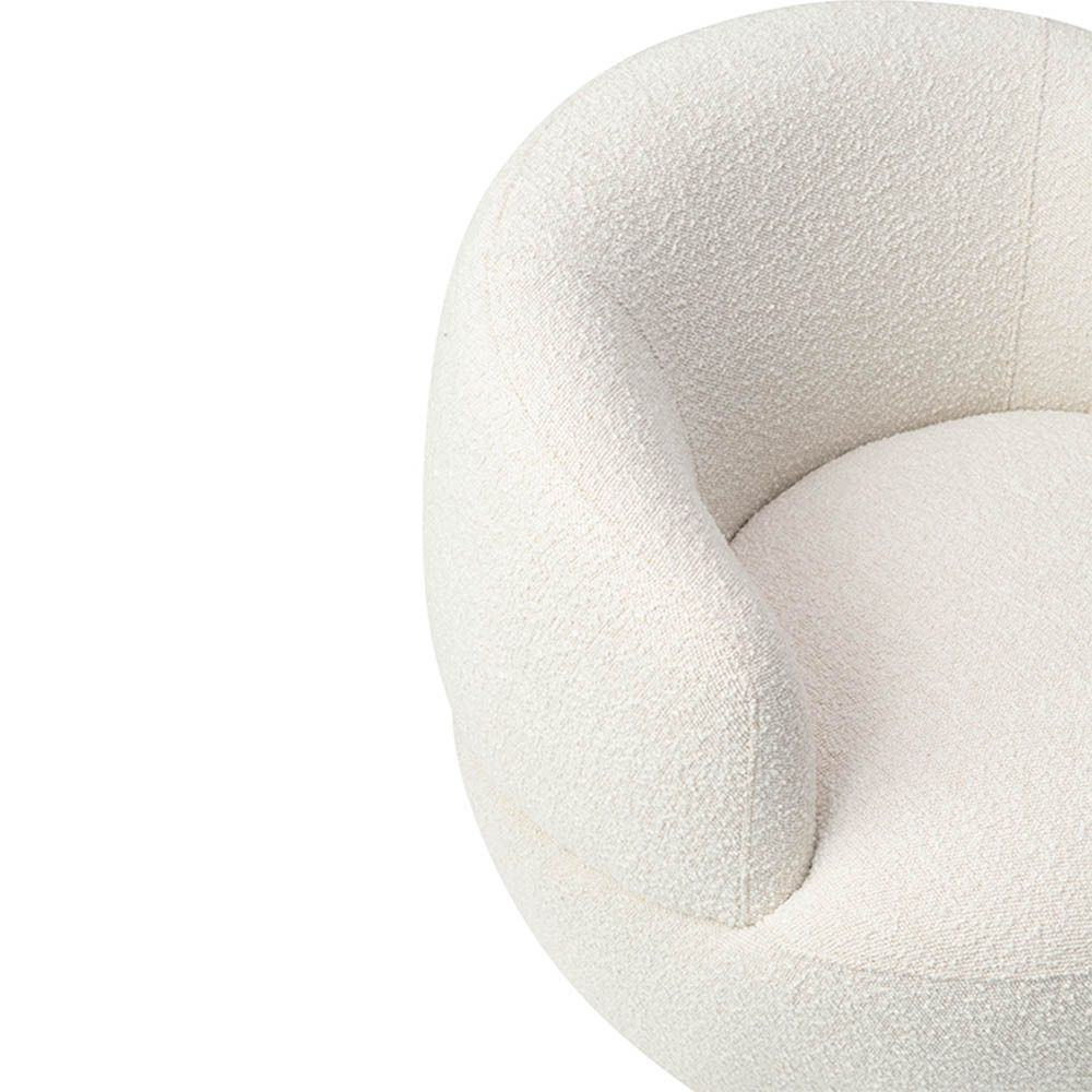 Small and circular boucle sand swivel chair with rounded edges and brass base