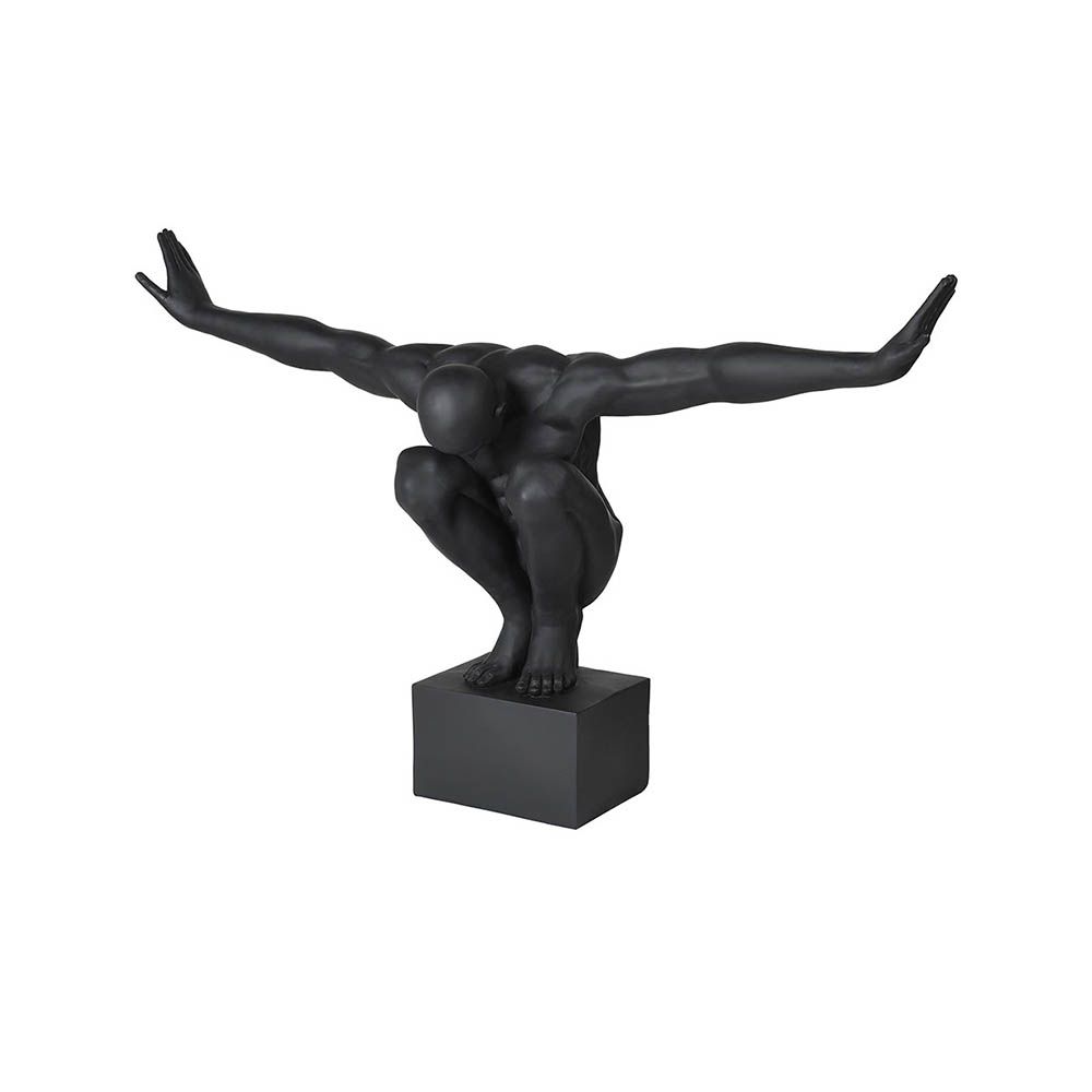 sculpture of a figure striking a pose with arms outstretched