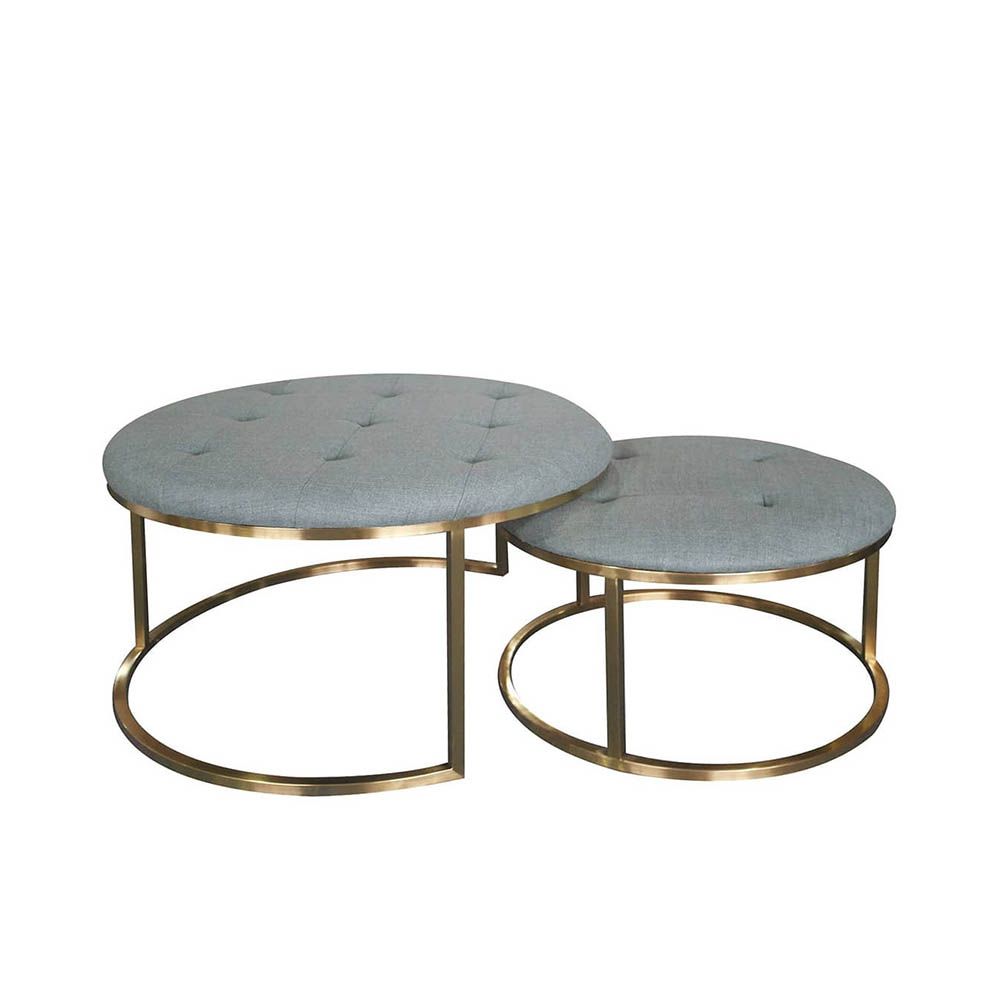 Sumptuous pouffe seating with deep buttoning and brass base frame