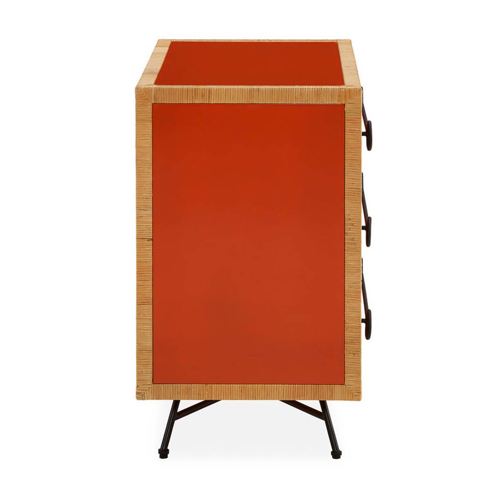 Red and orange chest of three drawers with rattan edges