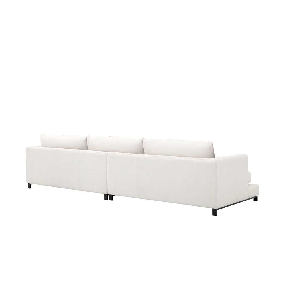 A contemporary white sofa with contrasting black legs 
