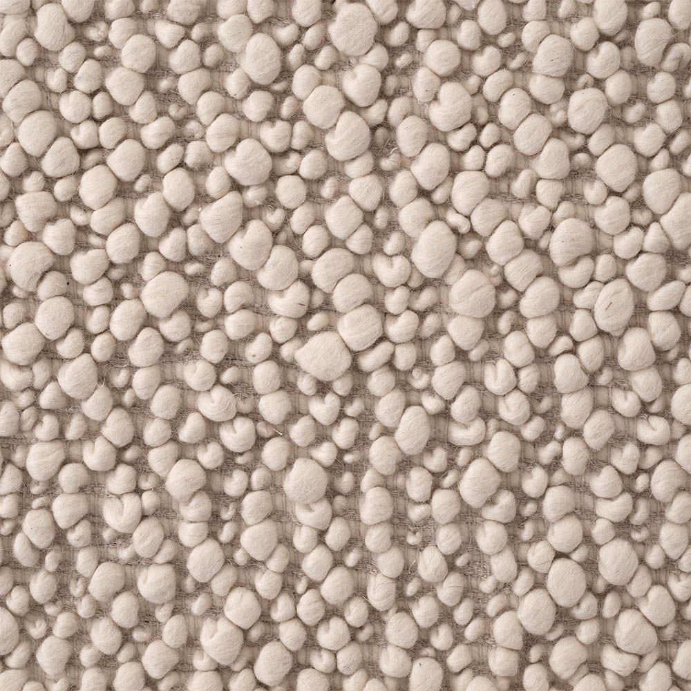 A gorgeous, bobbled texture, wool rug in a beige finish 