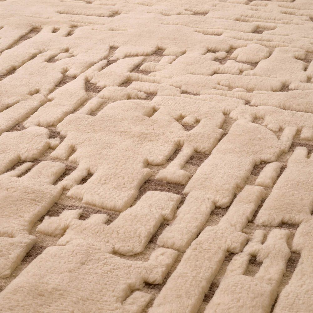 Artistic textured rug with plush wool composition and beige tones
