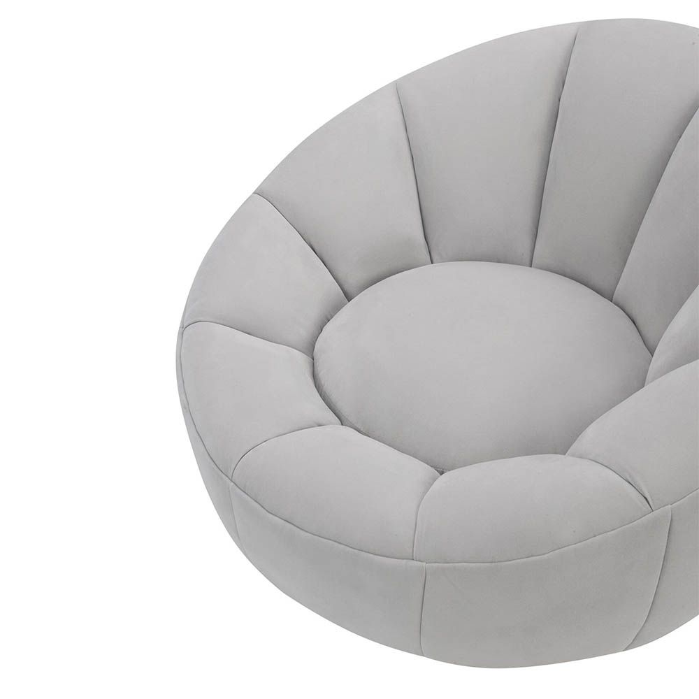 Statement grey velvet swivel chair with enveloping shell-shaped backrest 