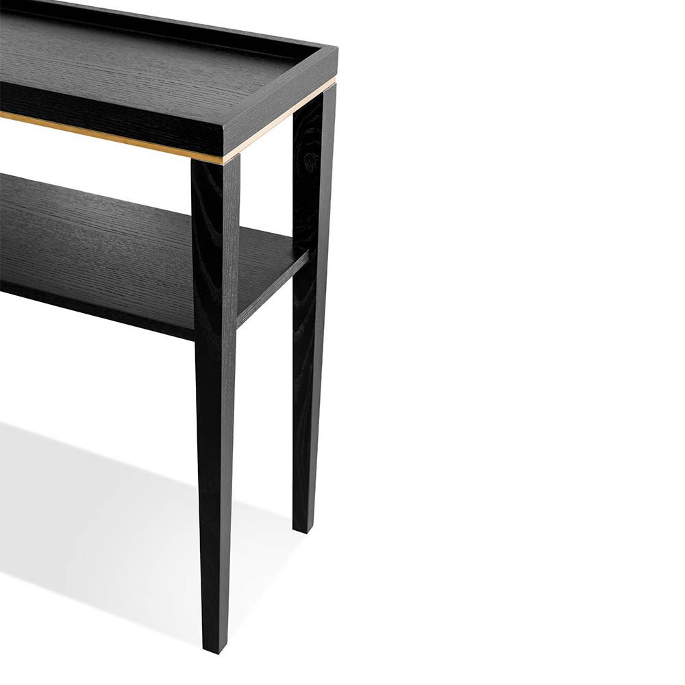 Console table with solid wood legs and finished in a brushed brass 