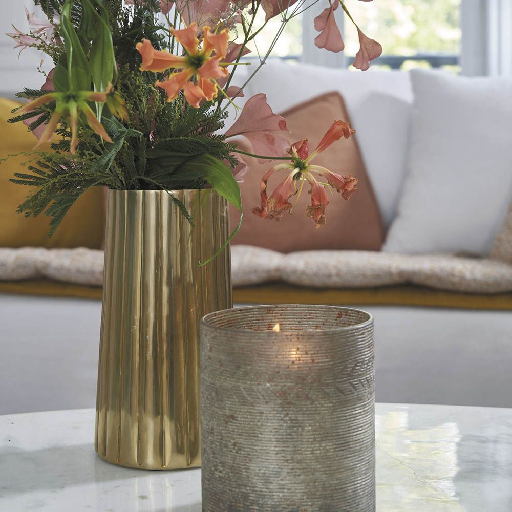 Elegant golden vase with ribbed texture