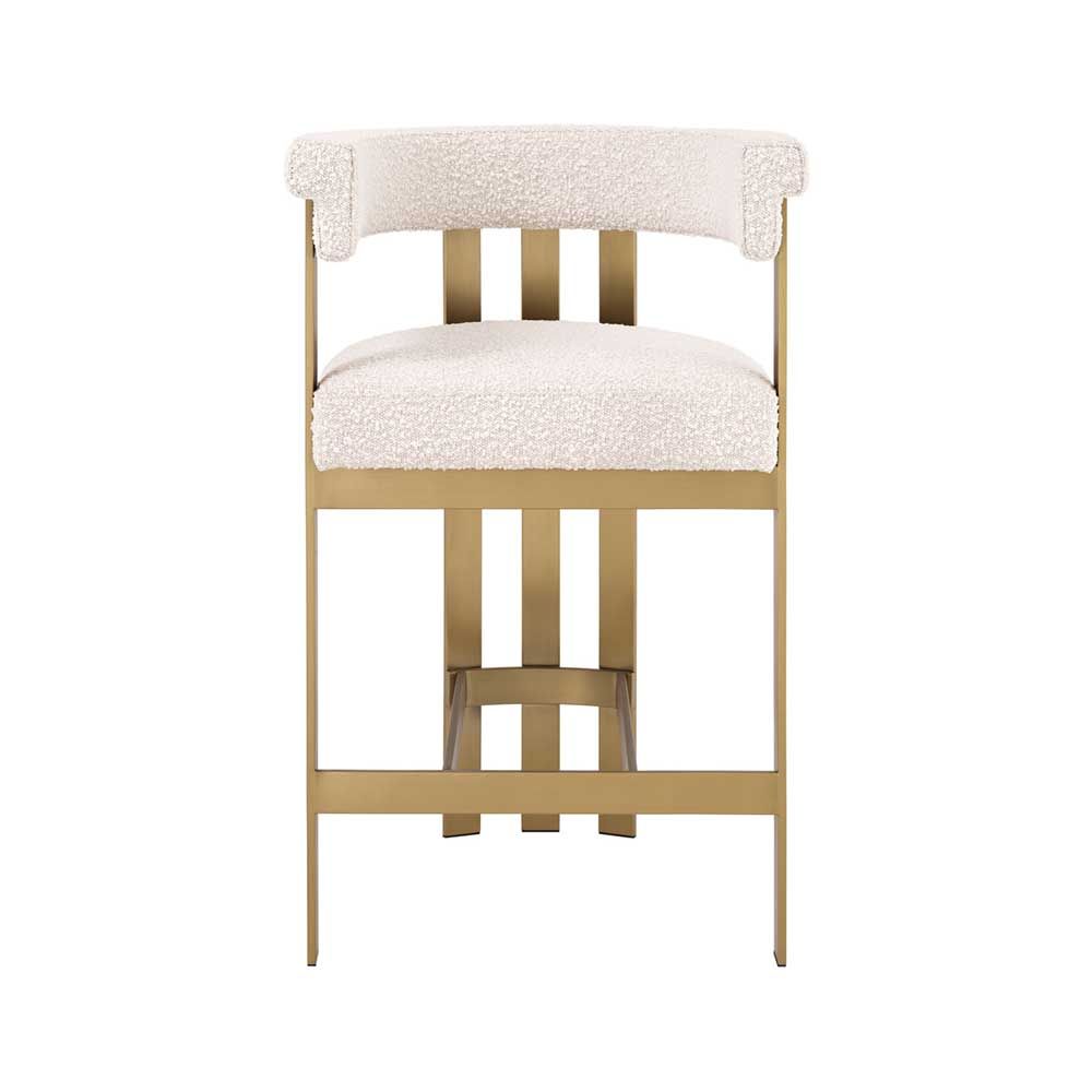 Glamorous brass frame counter stool and cream boucle upholstery