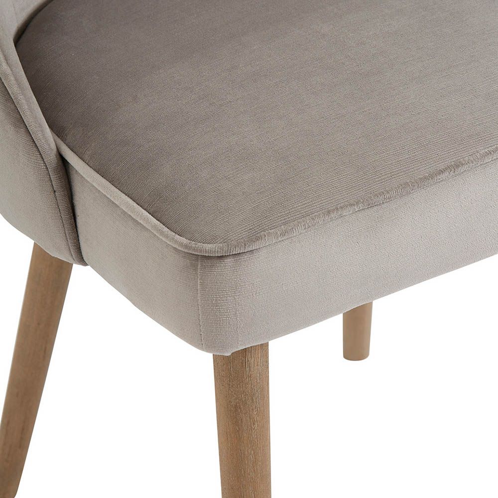 greige velvet chair with wooden legs