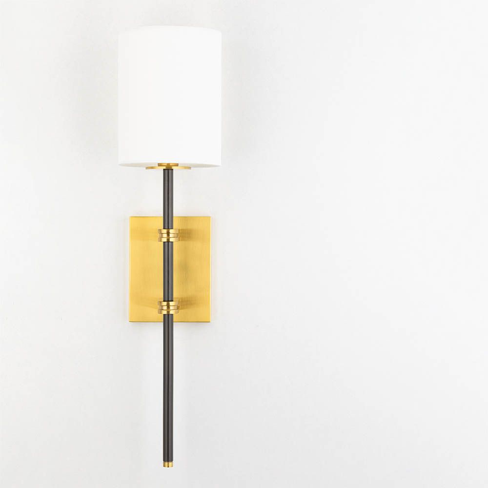 Modern wall sconce with brass fixture for added glamour