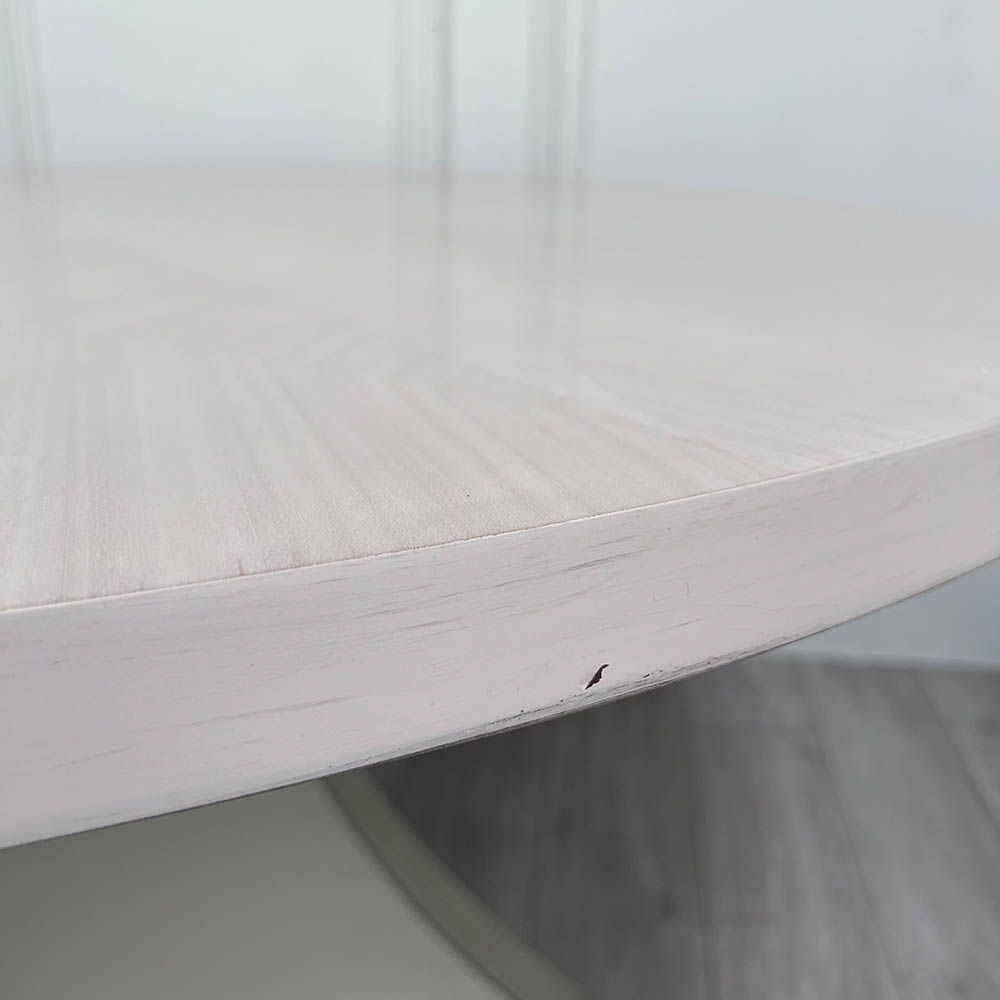 Round and decorative dining table with sculptural base