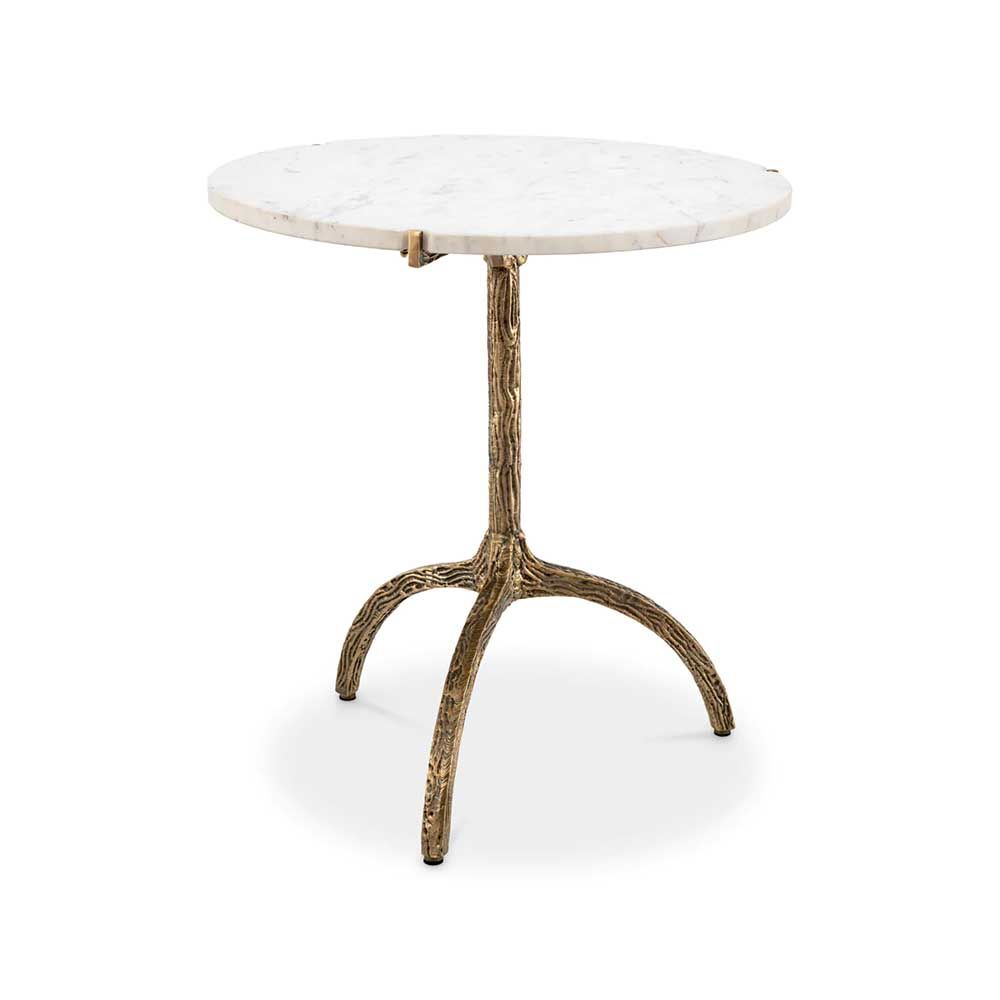 A stylish white marble dining table with a hammered antique brass base
