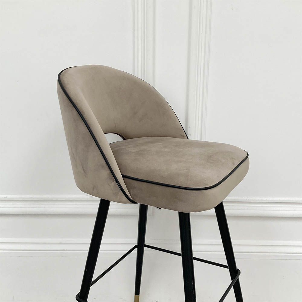 Stylish bar stool upholstered in greige velvet with metal tapered legs 