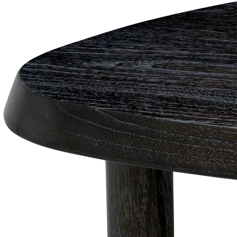Black wooden coffee table with pebble-shaped top and three legs