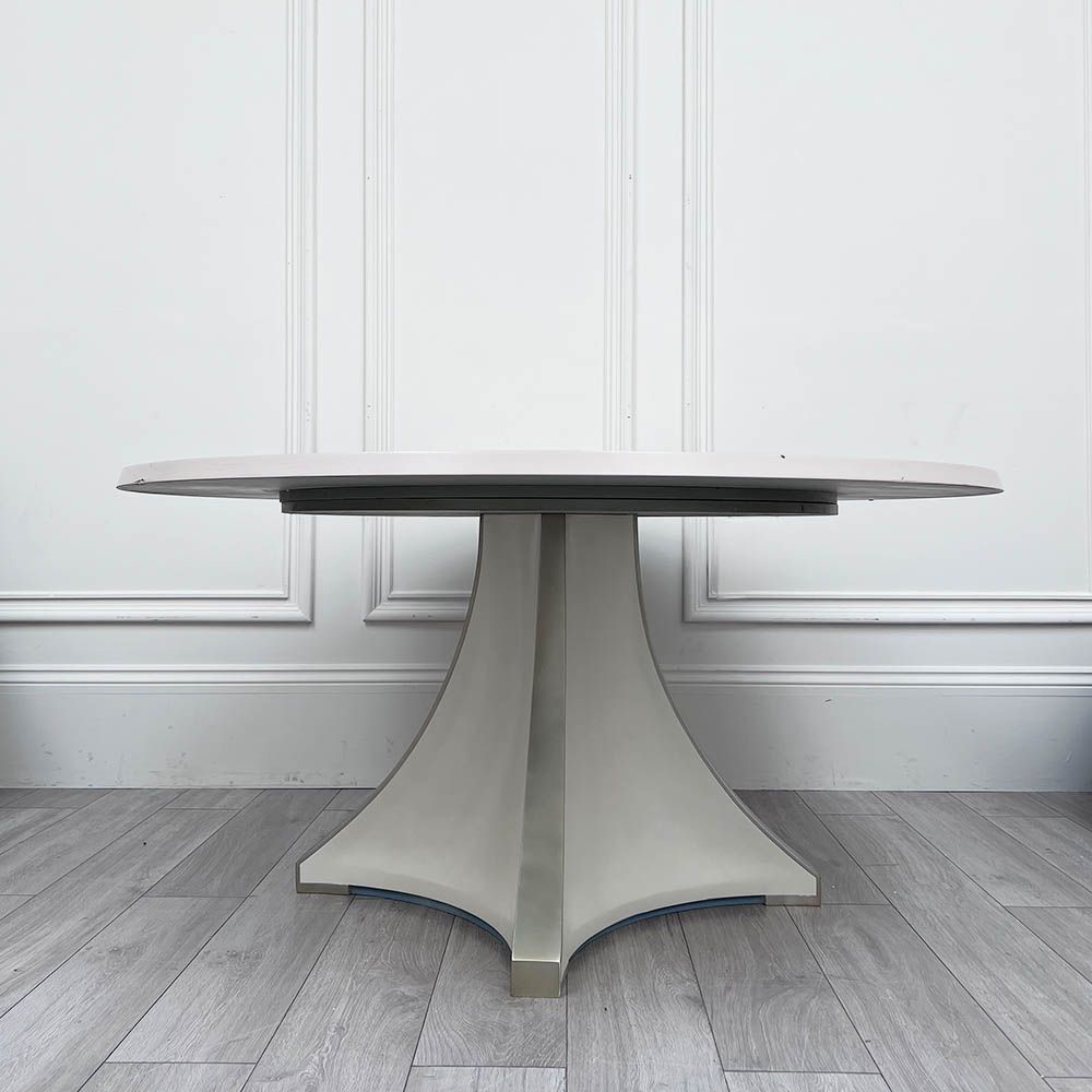 Round and decorative dining table with sculptural base