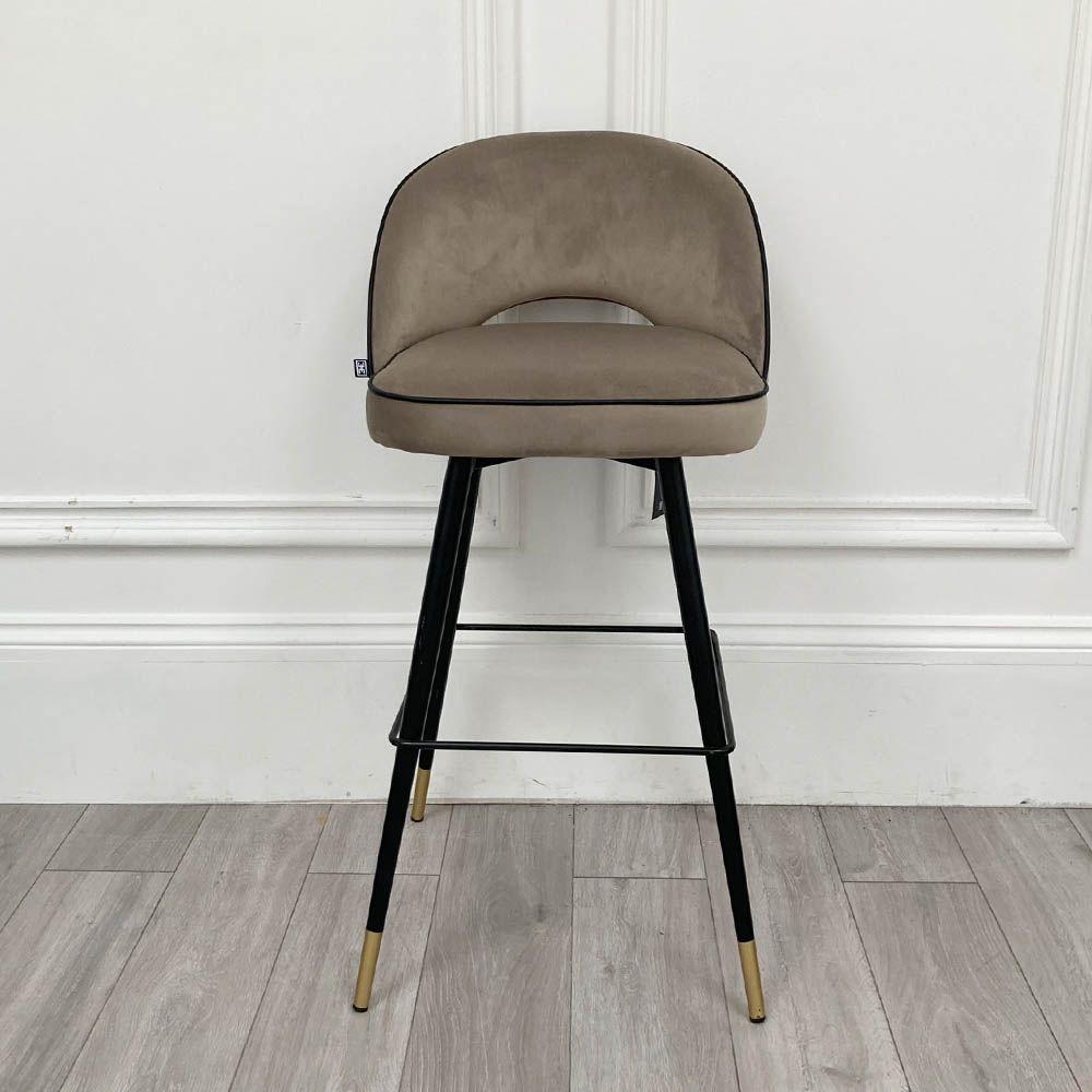 Stylish bar stool upholstered in greige velvet with metal tapered legs 