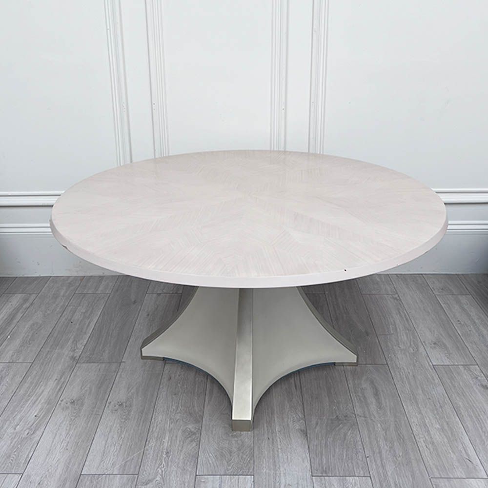 Round and decorative dining table with sculptural base