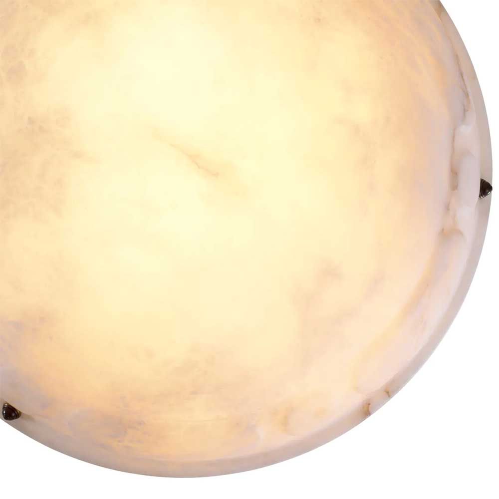 Alabaster dish-style pendant light with brass chain suspension