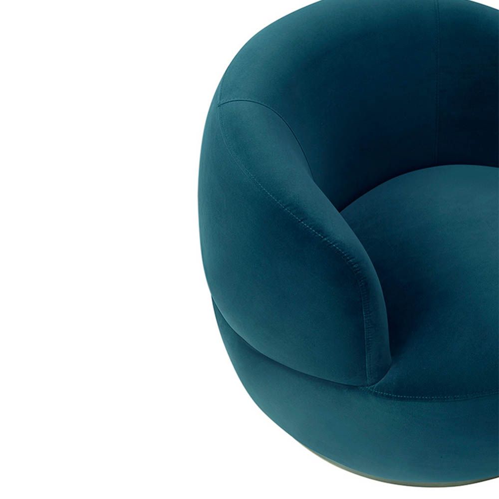 Small and circular blue swivel chair with rounded edges and brass base