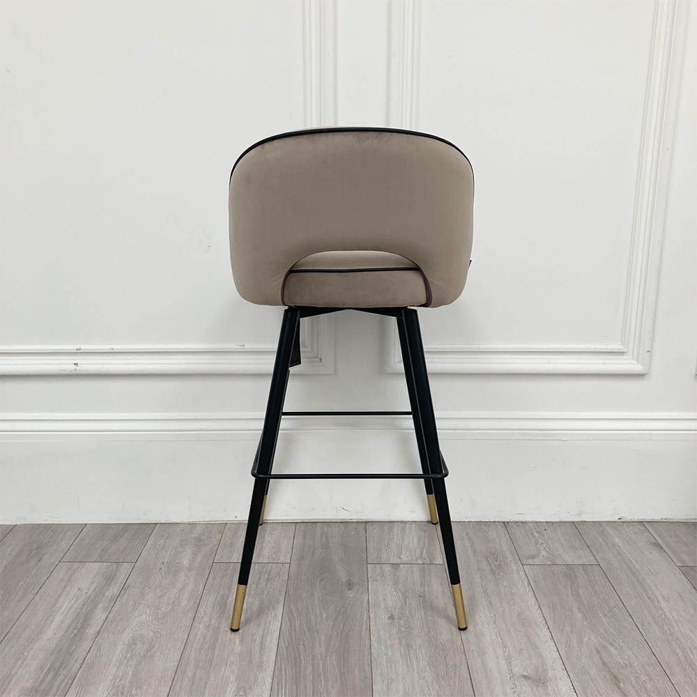 Stylish bar stool upholstered in greige velvet with metal tapered legs 