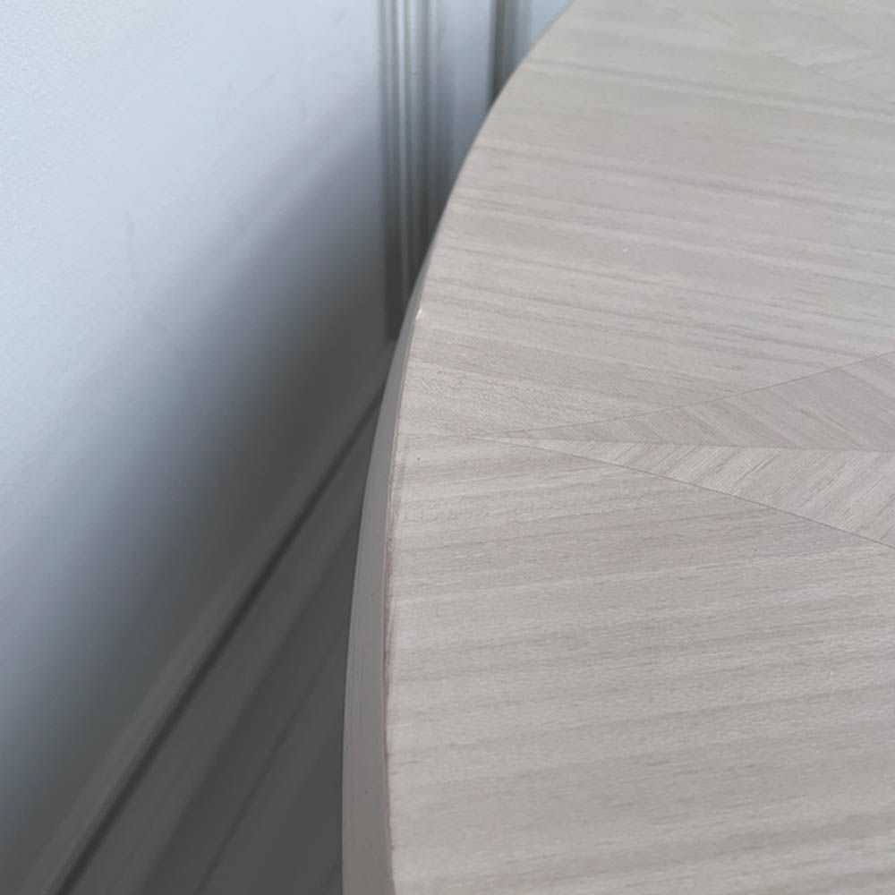 Round and decorative dining table with sculptural base